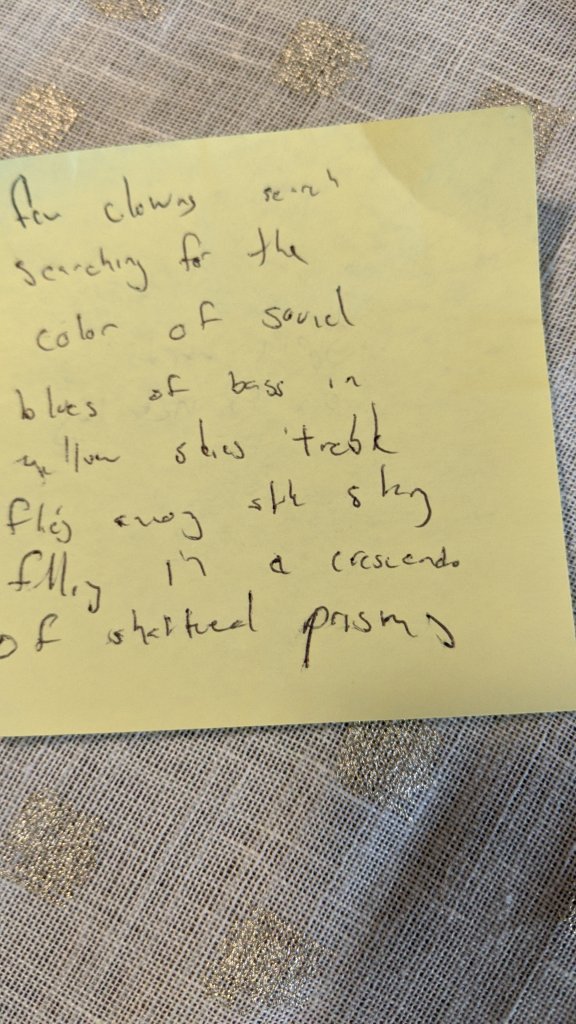 a post it note with ideas for a poem jotted down